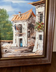 Painting of European Homes signed Ecco framed bright Art On Cork board 8 By 10