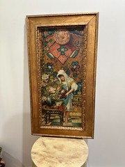 ANTIQUE FRAMED PAINTING ON HAND MADE CANVAS OF A GIRL WATERING THE INDOOR FLOWER