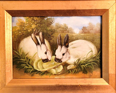 GILT FRAMED PAINTING ON BOARD OF A PAIR OF WHITE RABBITS EATING LETTUCE, 11.5“L