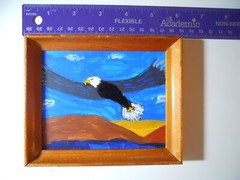Folk art acrylic painting of Bald Eagle flying over the Snake River in Wyoming.