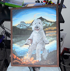 Beautiful dog painting sitting by the mountains