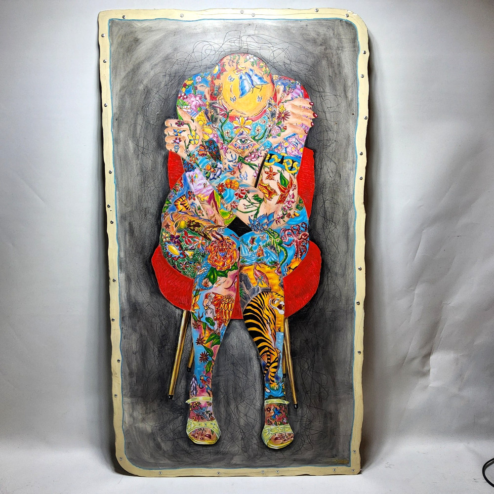 Tattooed nude bald woman chair painting human figure etched art colorful gallery