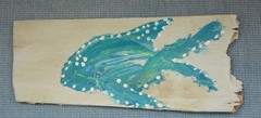 Two shingles from Cape Cod, Massachusetts that are painted with colorful fish!