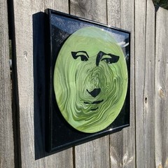 Acrylic Pour Painting resembling the Mona Lisa on a pop art style vinyl record