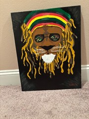 A Rasta Lion that’s hand painted on canvas original artwork
