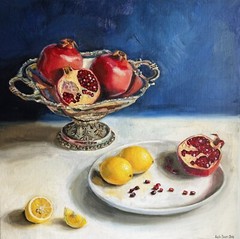 Pomegranate in decorative metal bowl still life