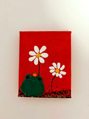 Cute little green frog with tangerine magnet in a red field of daisies painting