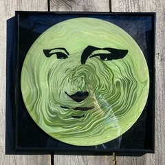 Acrylic Pour Painting resembling the Mona Lisa on a pop art style vinyl record