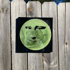 Acrylic Pour Painting resembling the Mona Lisa on a pop art style vinyl record
