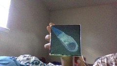 homemade painting of a comet in space flying by made by using acrylic paint