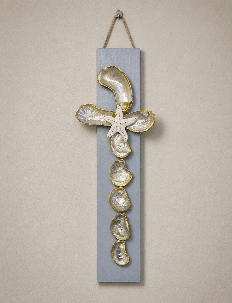 Hand crafted gray seashell cross wall art. 24in tall and 4in wide.