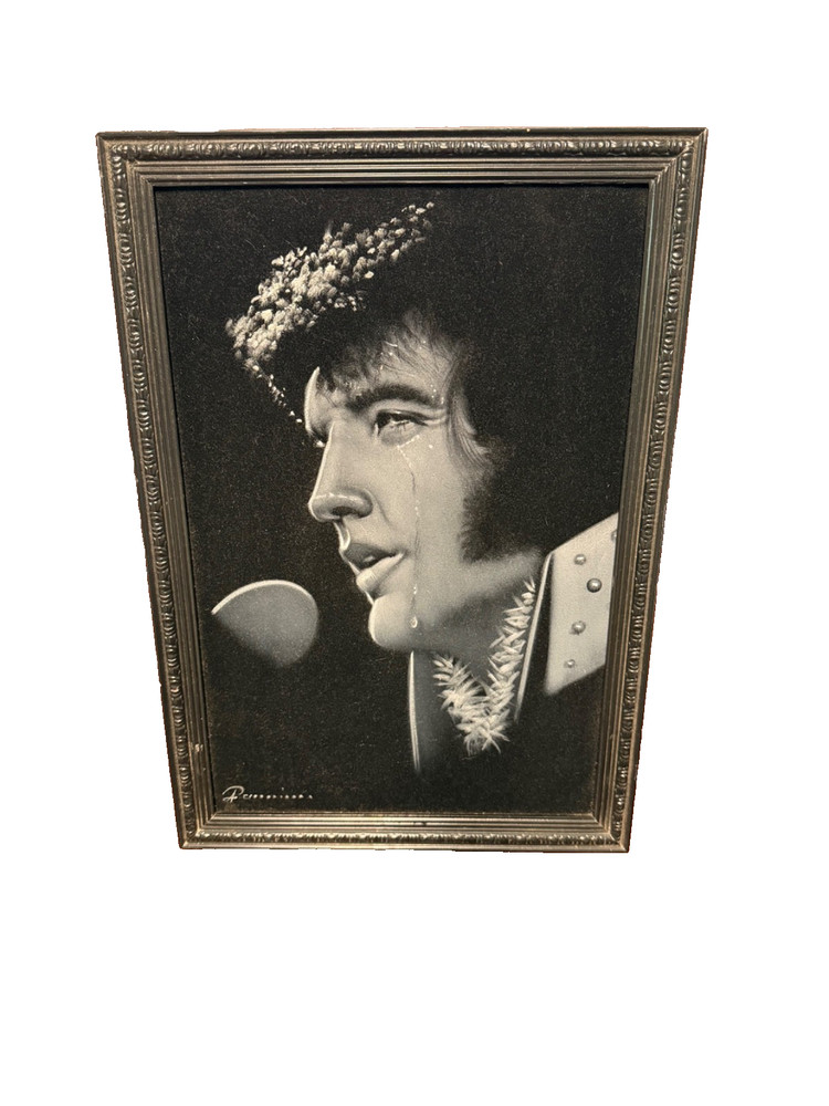 vintage black velvet painting of a crying Elvis Presley.