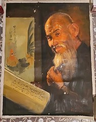 Wahso Chan Oil Painting of Chinese Man reading from a scroll, w/ a small rooster
