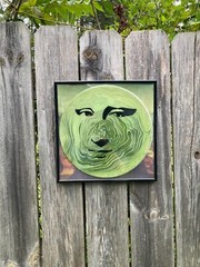 Acrylic Pour Painting resembling the Mona Lisa on a pop art style vinyl record