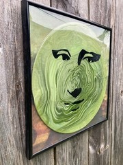 Acrylic Pour Painting resembling the Mona Lisa on a pop art style vinyl record