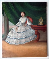 19th Century folk art oil painting of an elegant lady in a circa 1850’s gown