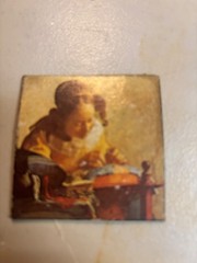 The Lacemaker (La Dentellière) by the Dutch Master Johannes Vermeer.