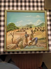 African Village Oil On Canvas Painting by J.H Chilungo 17 1/2 x16 1/4 H Framed
