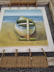 Framed Nautical Painting of a sail boat on a Beach