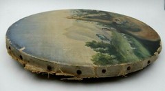 ANTIQUE SOUTH AMERICAN WOMAN BESIDE HUT PAINTING IN HANDCRAFTED ROUND FRAME
