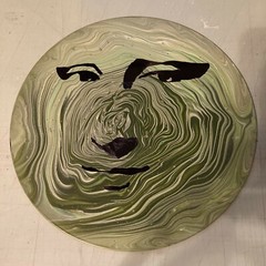 Acrylic Pour Painting resembling the Mona Lisa on a pop art style vinyl record