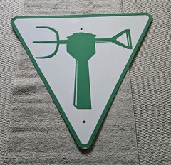 Street Grafitti Art Painted Sign Green Arm Pitchfork Empowerment Zone White
