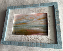 Original desert sky painting in blue and white distressed frame. Signed art.