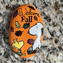 hand painted rocks .. Snoopy and Woodstock ready for Fall!