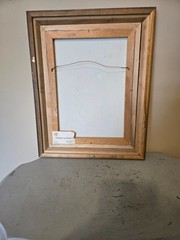 vintage framed artwork depicts white calla lilies in vases