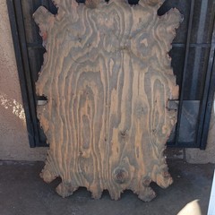 This is a vintage 1970s resin-coated wood slab wall hanging John Pitres