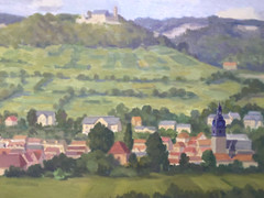 Oil painting village with church in front of hilly landscape with castle