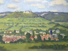 Oil painting village with church in front of hilly landscape with castle